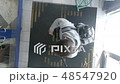 Man enters to the shop with bike 48547920
