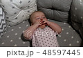 Newborn baby. Little baby. Child. Adorable baby girl. Baby in crib. Baby in bed 48597445
