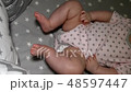 Newborn baby. Little baby. Child. Adorable baby girl. Baby in crib. Baby in bed 48597447