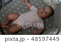 Newborn baby. Little baby. Child. Adorable baby girl. Baby in crib. Baby in bed 48597449