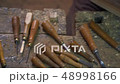 Overhead pan from a set of chisels to wood carver. 48998166
