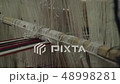 Obsolete wooden weaving machine. 48998281