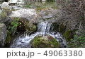 Slow motion Flowing water stream, water drops and reflection 49063380