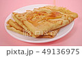 pouring pancakes with maple syrup pink background 49136975