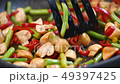 Stir Fry Cooking mushrooms and vegetables 49397425