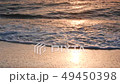Sea Waves With Foam Are Swashing on a Sandy Beach 49450398