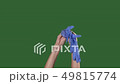 Green screen. Chromakey. Woman puts the medical gloves. 49815774