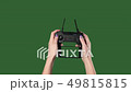 Chromakey. Green screen. Remote from quadrocopter in the hands of woman. 49815815