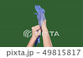 Chromakey. Green screen. Woman puts the medical gloves. 49815817