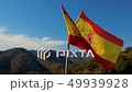 Teared up Spanish flag waving in slow motion 49939928
