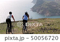Young couple by mountain bicycles 50056720