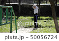 Girl in the park plays sports 50056724