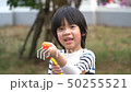 Cute Asian child playing with water gun  50255521