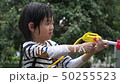 Cute Asian child playing with water gun  50255523