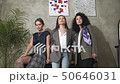 Three beautiful young girls in business suits. Business style.  50646031