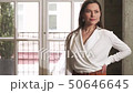 Beautiful young brunette in a business suit. Posing at a photo shoot 50646645