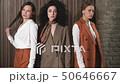 Three beautiful young girls in business suits. Business style.  50646667