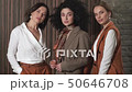 Three beautiful young girls in business suits. Business style.  50646708