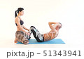 Young Couple Doing Sit-Ups 51343941