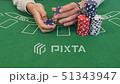 Man Shuffling Poker Chips 51343947