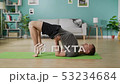Young man doing yoga in the morning in his living room 53234684