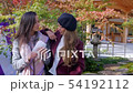 International women eating Japanese street food. 54192112
