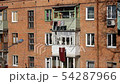 Windows and balconies of the old brick apartment 54287966