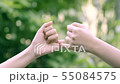 hands hook each other's little finger on nature ba 55084575