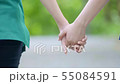 two asian woman holding hands and moving foward 55084591