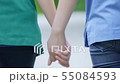 two asian woman holding hands and moving foward 55084593