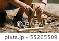 A man tries to lay down a fire. Unsuccessful attempt to lay down a fire. Tourism, travel, green 55265509