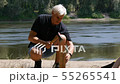 A man chopping wood for a fire. Close-up. Hiking, travel, green tourism concept. Healthy active 55265541