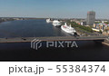 4k aerial view skyline of Daugava river, bridge, cruise ships and city buildings 55384374