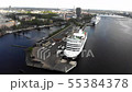 4k aerial view of cruise ships anchored on river Daugava, panoramic city view 55384378