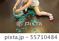 Child collects kinetic sand into the jar after the game 55710484