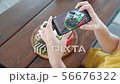 Food blogger hands using smartphone taking photo of beautiful beef steak on wood table. 56676322