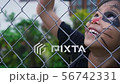 Girl is climbing the iron fence in halloween 56742331