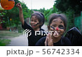 Girls is walking along the streets in halloween 56742334