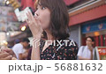 Exploring couple eating street food in Osaka  Exploring couple eating street food in Osaka  56881632