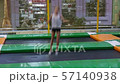 girl jumping on a trampoline 57140938