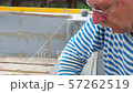 Bricklayer putting down another row of bricks in site 57262519
