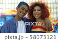 Cool couple of millennials smiling on camera 58073121
