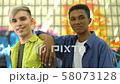 Two fashionable teenagers looking camera, urban 58073128