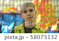 Pierced young man looking camera standing graffiti 58073132