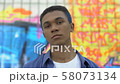 Cool male teenager with colored hair looking 58073134