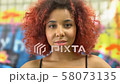 Stylish red-haired teenager with pierced nose 58073135