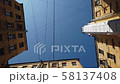 Sky and buildings with a web of wires 58137408