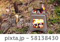 Close up of wood burning folding twig stove in forest background 58138430