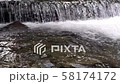 Wide waterfall on a mountain river in dark summer  58174172