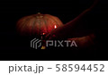 Halloween pumpkin head jack have the hands extended in and placed candles in the pumpkin.halloween and holidays concept.4K UHD video. 58594452